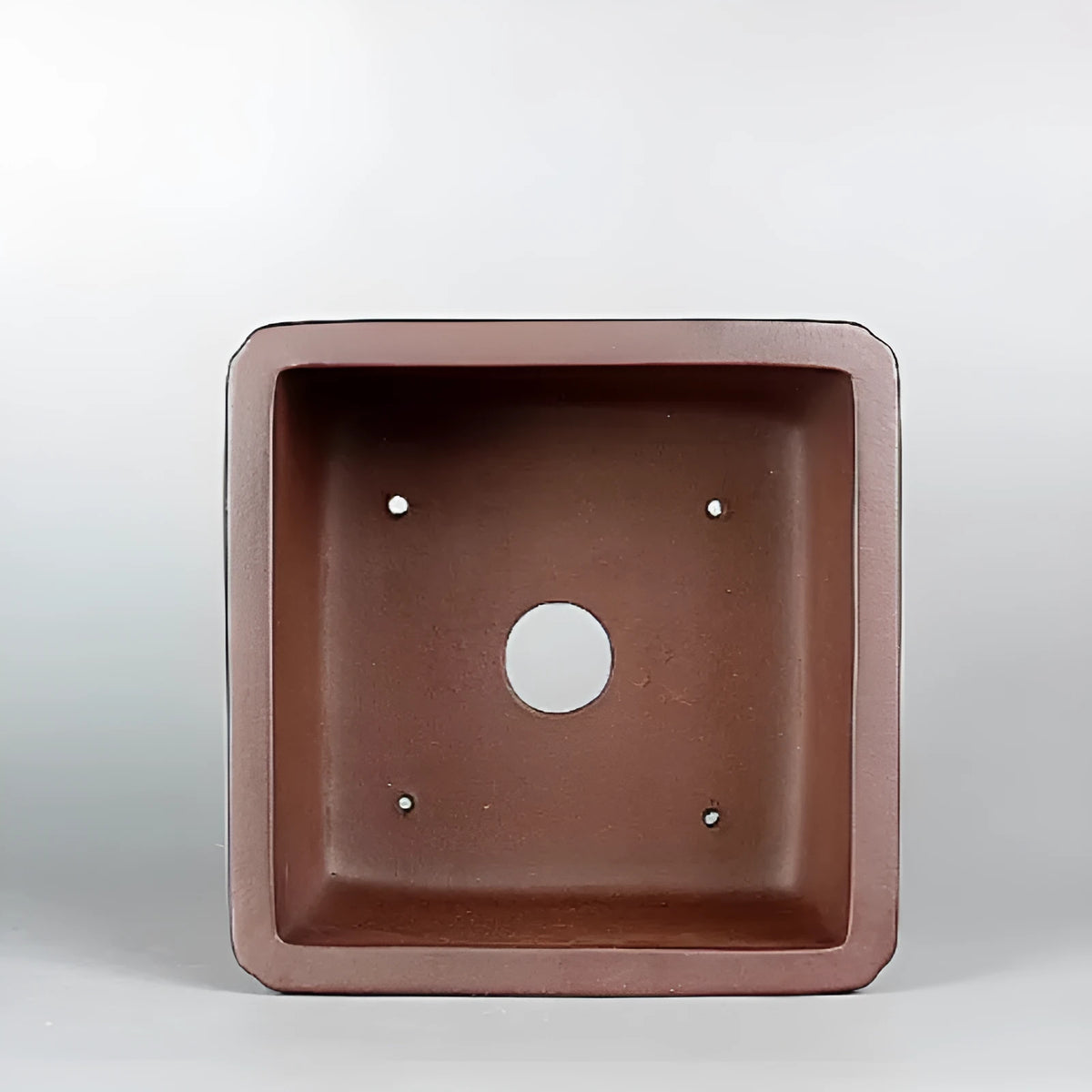 Handmade brown antique style purple clay flower pot measuring 19x19 cm