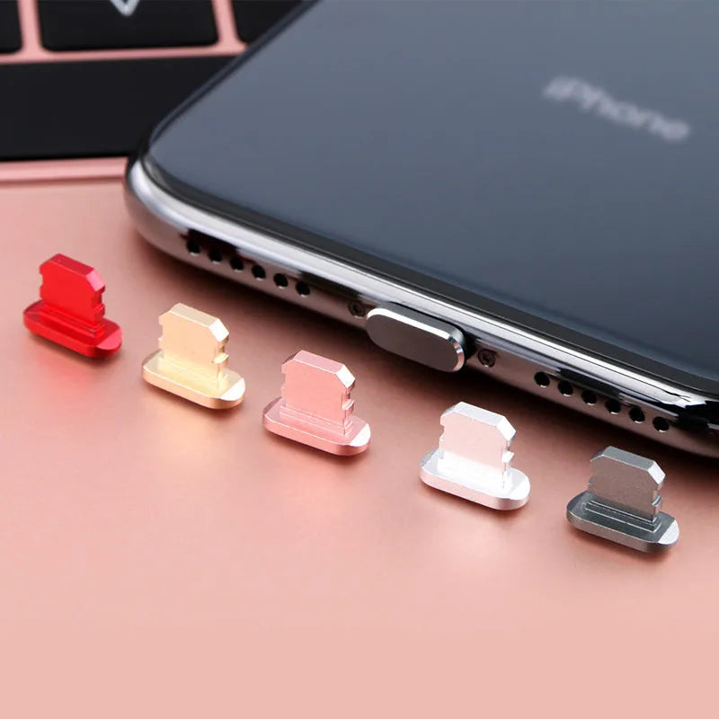 Aluminium alloy dust plug for iPhone charging port in various colours.