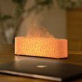 Creative square desktop humidifier and aroma diffuser with colourful flame lighting effect in black and white colour options.