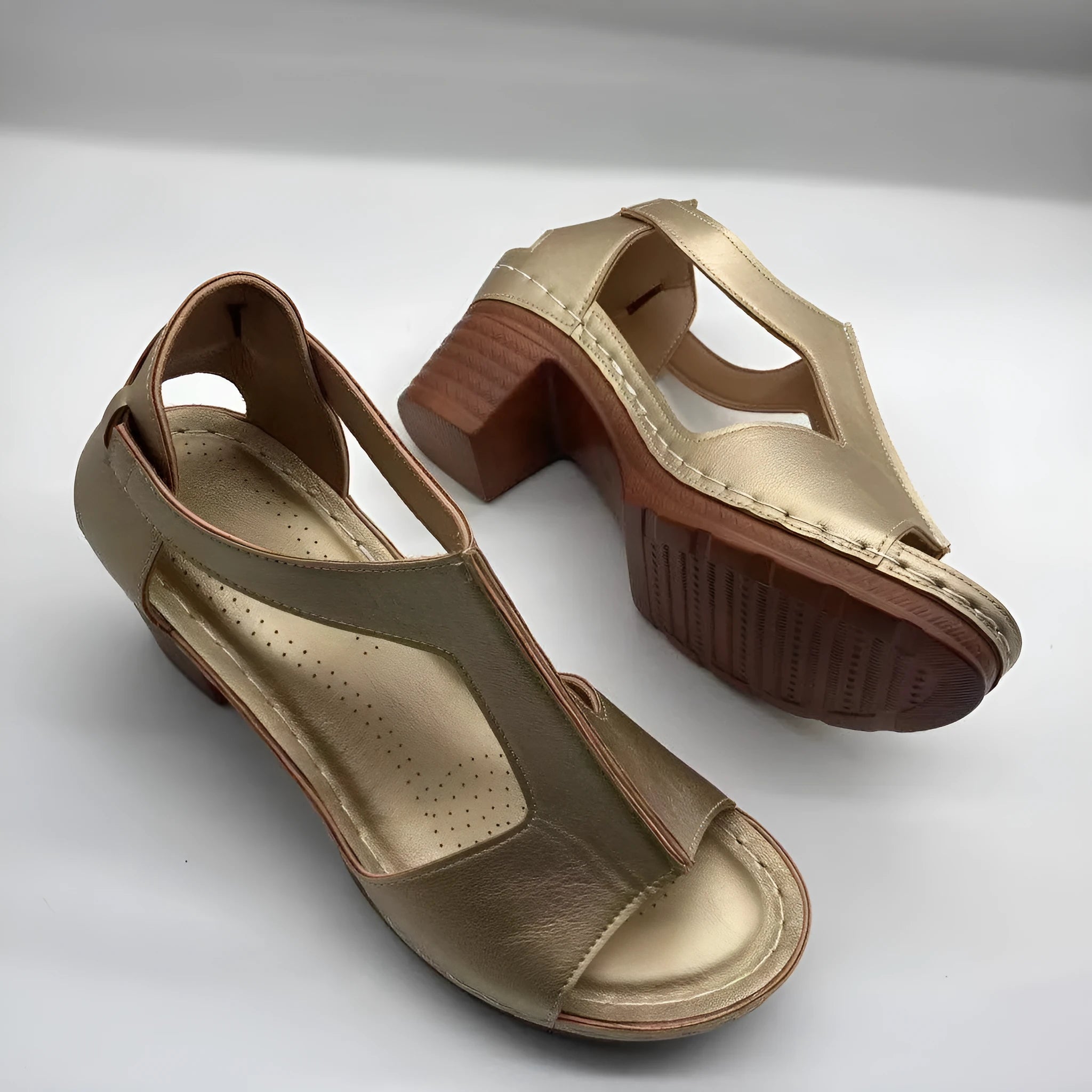 Plus size beige wedge sandals with peep toe, open sides, and a Roman-style ankle buckle.