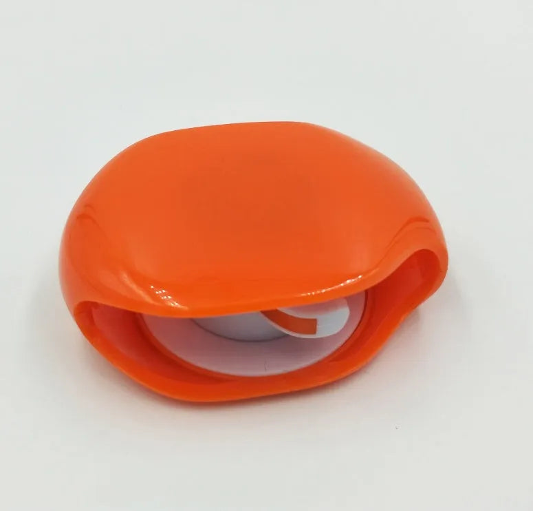 Automatic earphone cable winder retractor in various colours on a white background.