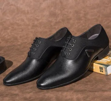 Men's black Oxford shoe with artificial PU leather upper and rubber sole on a white background.