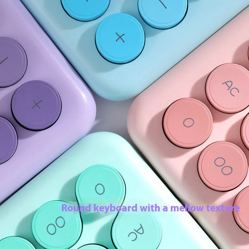 Gradient colour desktop calculator in ABS plastic showing four colour variants.