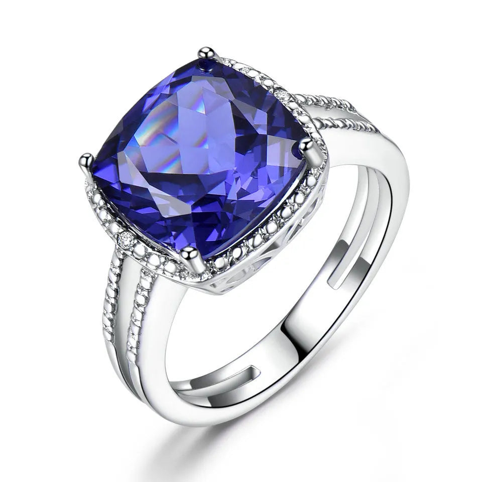 Blue tanzanite stone set in a sterling silver women's ring, shown in size 8.