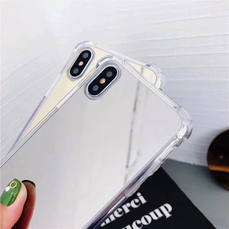 Mirror phone case for iPhone showing reflective back surface and soft TPU edges in multiple colour options.