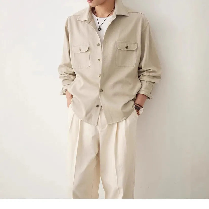 Men's light sand rice coloured long sleeve shirt with a lapel collar, laid flat.