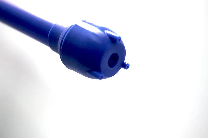 Manual hand-operated siphon pump with blue flexible tubing for transferring gasoline and oil.