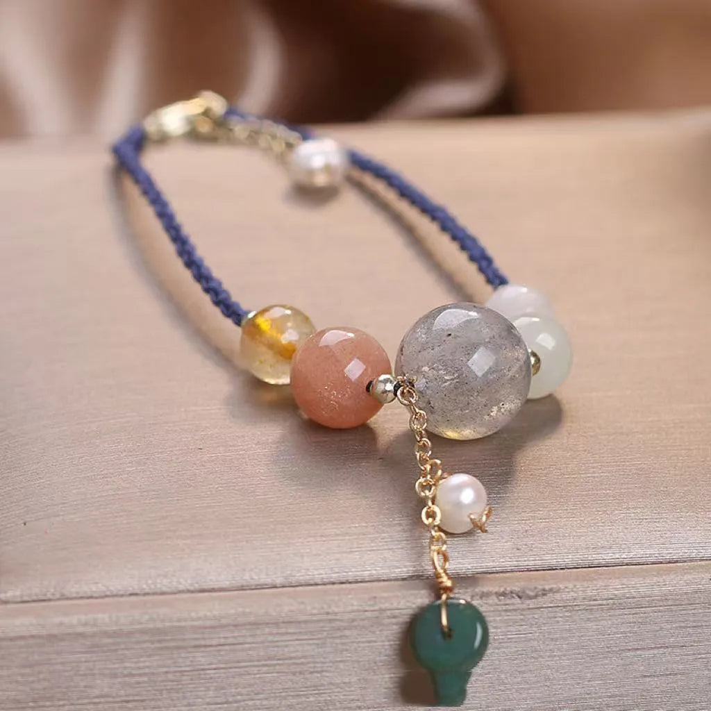 Hand-woven crystal sequin bracelet with peace buckle closure in blue, green and red colour options