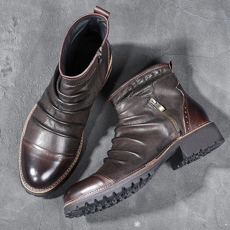 Men's brown side-zip cowboy Martin boots with round toe and horseshoe heel on a wooden background.