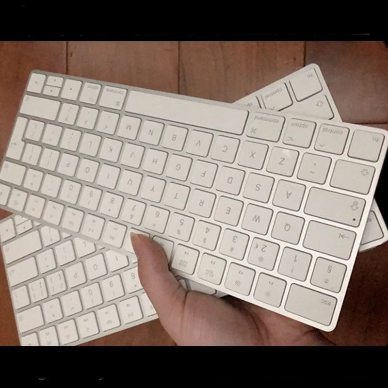 Apple Bluetooth wireless keyboard with white finish and ultra-thin metal casing