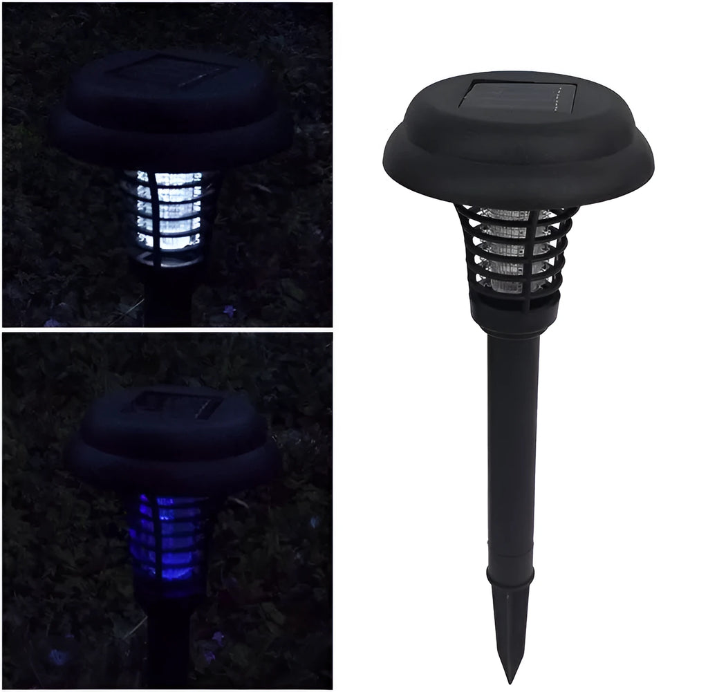 Black solar powered insect killing mosquito lawn lamp with white and purple light LEDs in a garden setting.