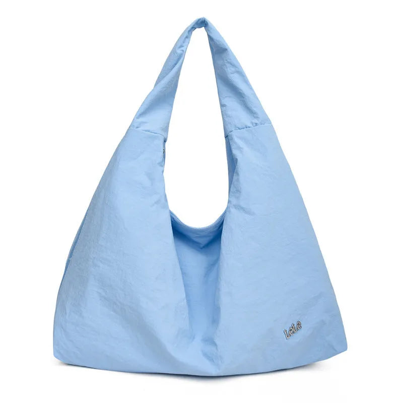 Heart-shaped nylon underarm bag for women in black, blue, khaki, and yellow colour options.