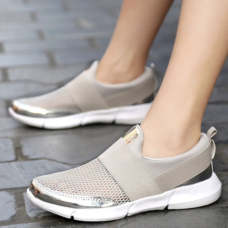 Low-top women's casual sneakers in blue, black, or grey with a mesh lining and textured sole.