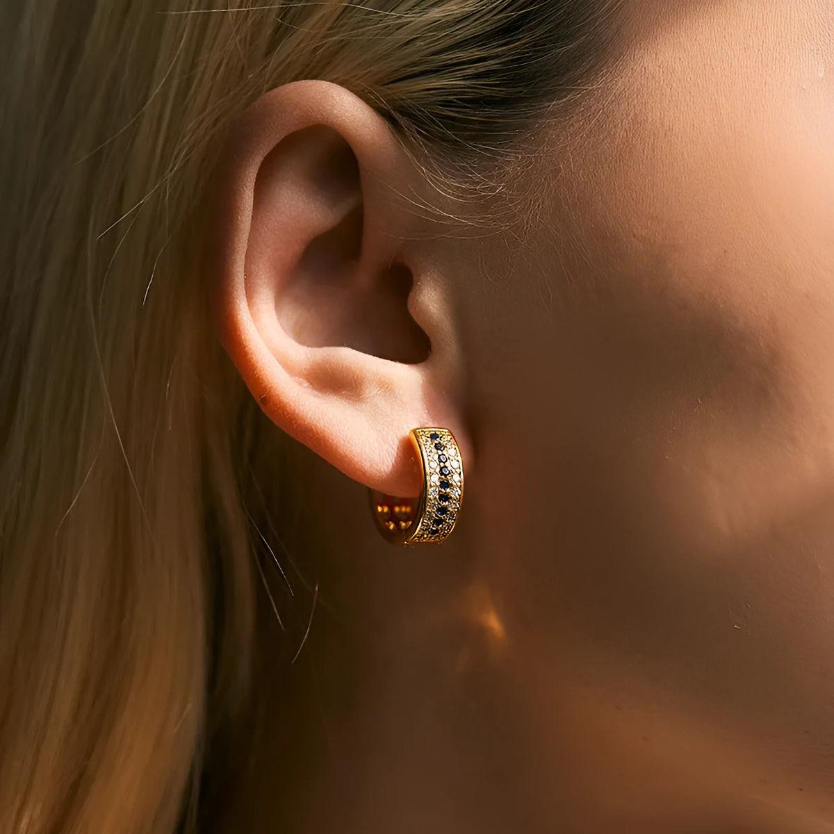 Round geometric women's earrings with copper construction and 18K gold electroplated finish.