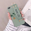 Green graffiti style iPhone case with integrated wristband holder showing back cover design