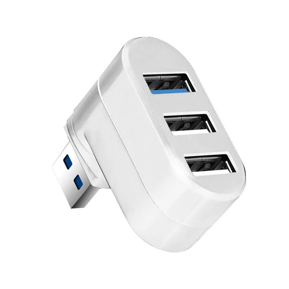 Black and white USB 3.0 hub with four ports and a rotating design on a desk.