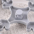 Rotating pet slow feeder bowl with game board surface and removable silicone licking mat in blue.