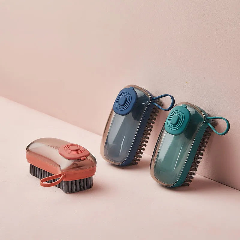 Blue automatic cleaning brush with soft bristles and a matching spare head on a white background.