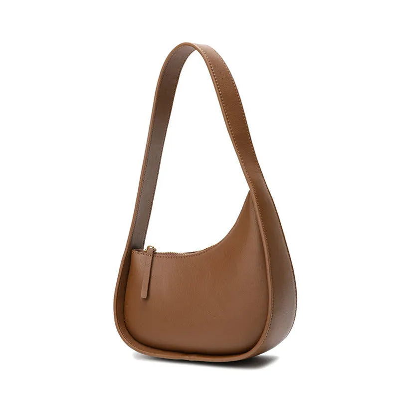 Half moon shaped leather women's shoulder bag with wide strap