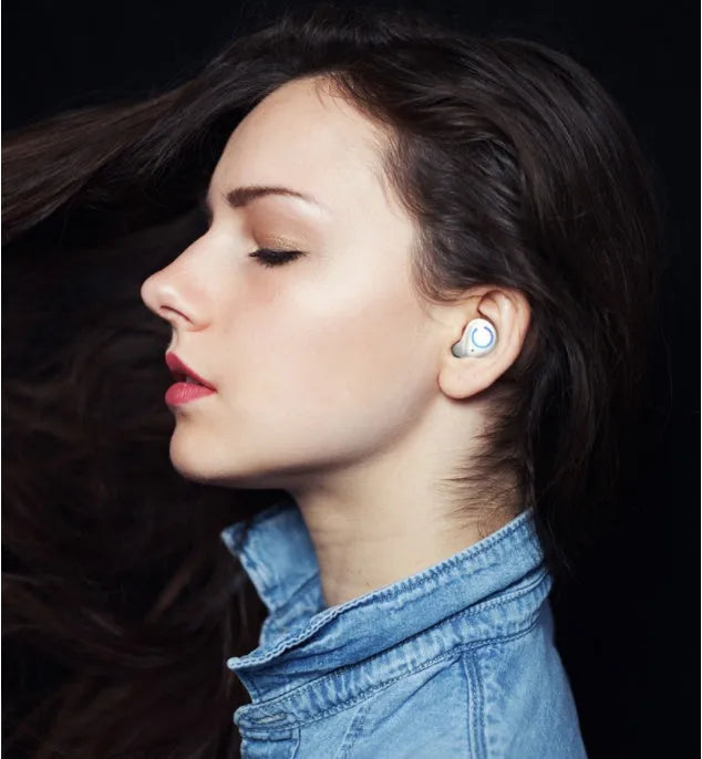 Black and white M18 true wireless in-ear headphones with compact rectangular charging case.