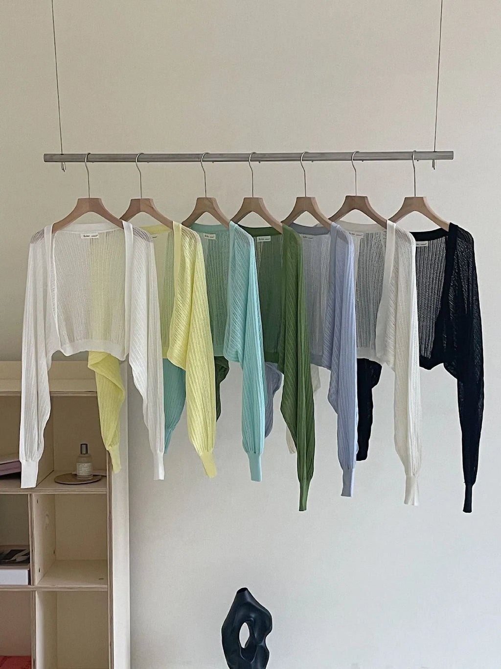 Women's hollow thin loose blouse with lantern sleeves in apricot colour showing slim fit and hollow-out detailing
