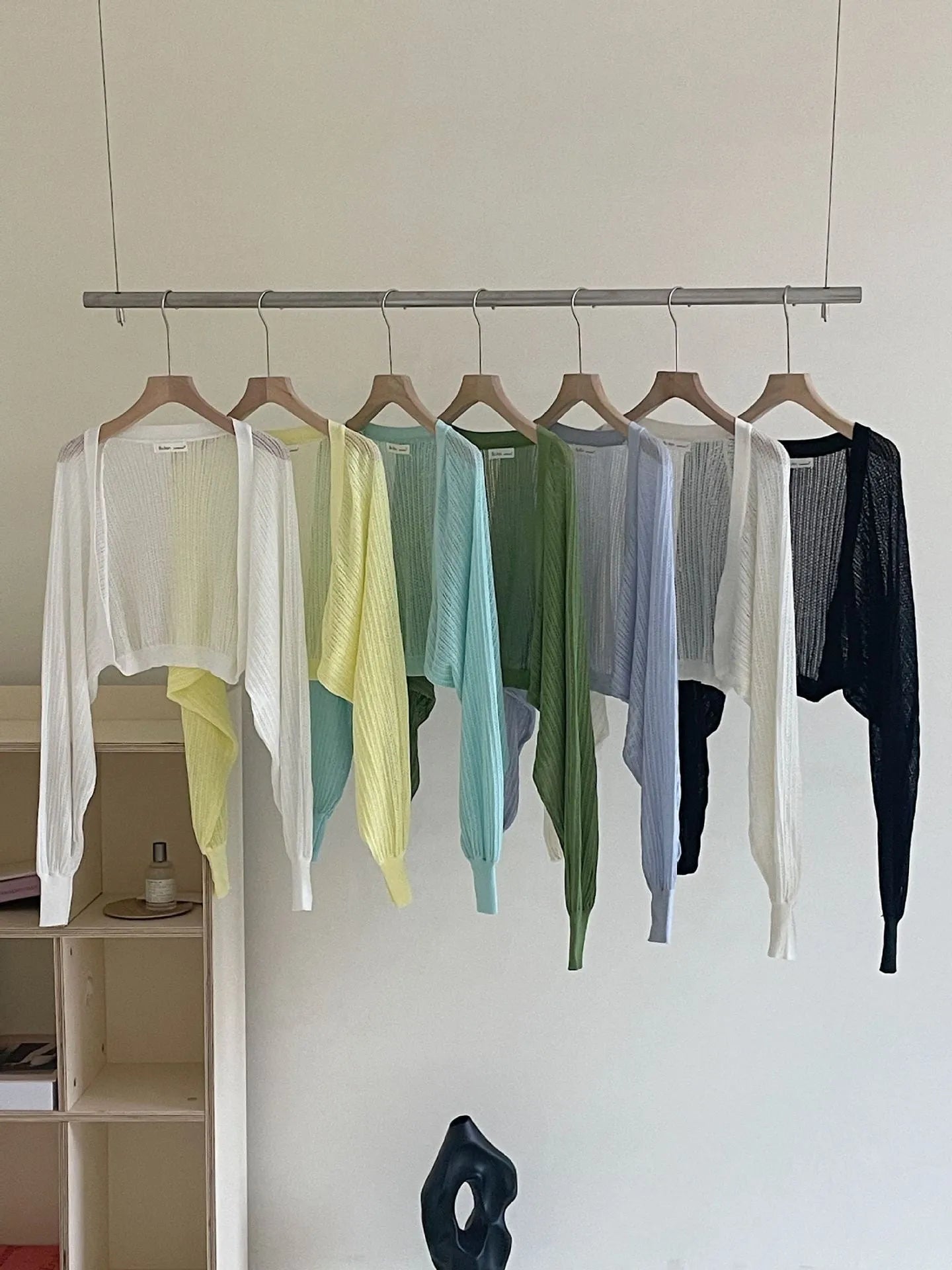 Women's hollow thin loose blouse with lantern sleeves in apricot colour showing slim fit and hollow-out detailing