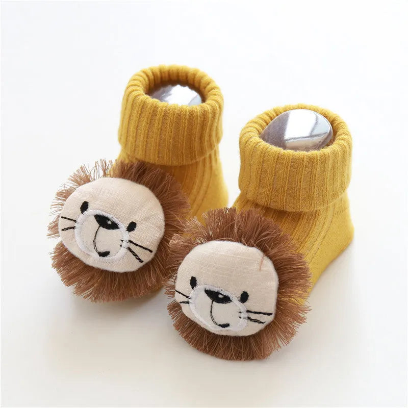 Cotton baby floor socks in a selection of colours and patterns like panda, lion, and bows, shown in sizes for infants.
