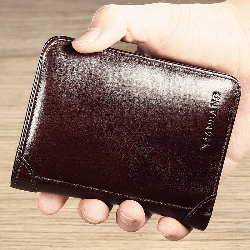 Men's leather organiser wallet open to show internal compartments including card slots and a zipped coin pocket.