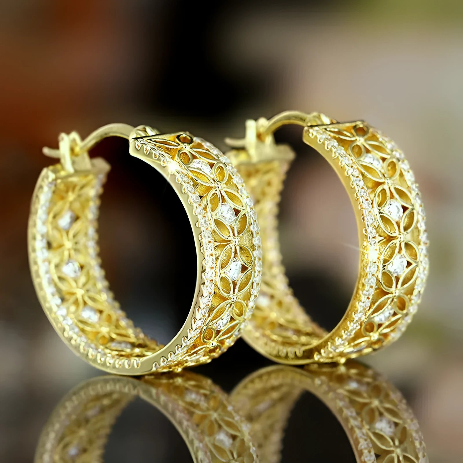 Women's yellow gold coloured geometric horse eye butterfly ear clips made from copper.