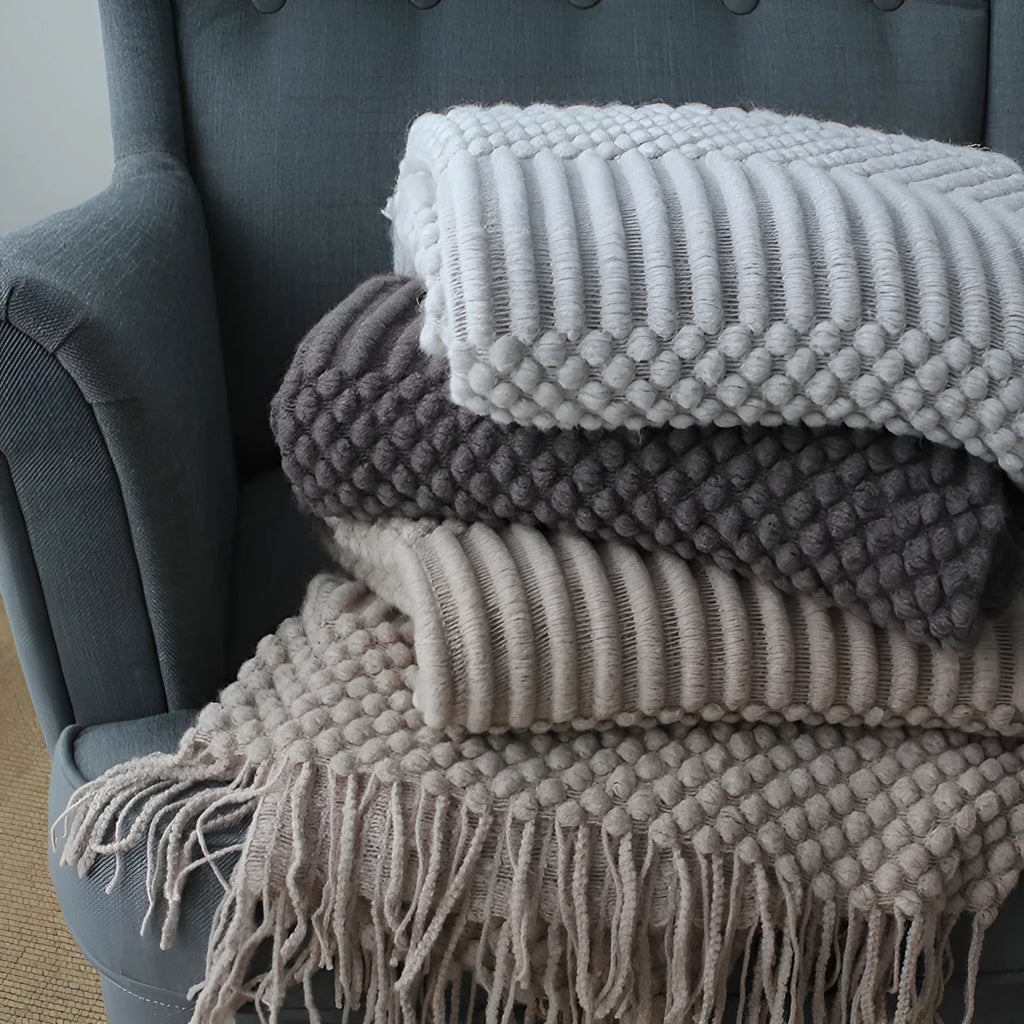 Small polyester nap blanket in dark grey, khaki, or light grey colours showing 127x170cm dimensions