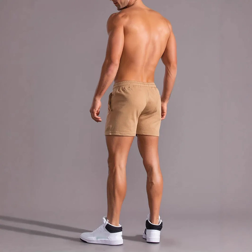Men's khaki sports shorts with coconut leaf print pattern and straight leg design