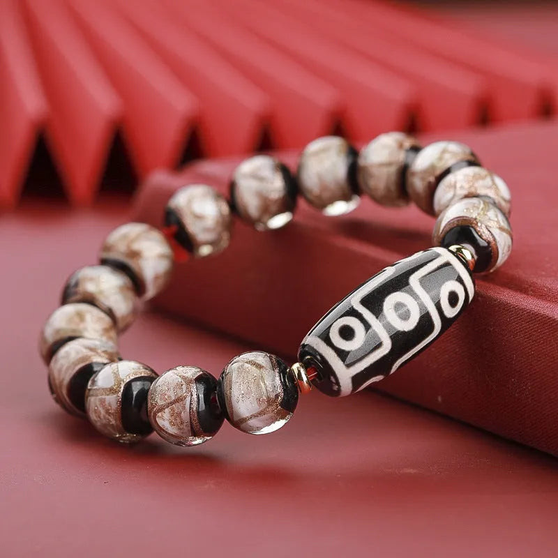 Handcrafted coloured glaze bracelet with Chinese auspicious patterns and snake beads in 10mm, 12mm, or 14mm sizes.