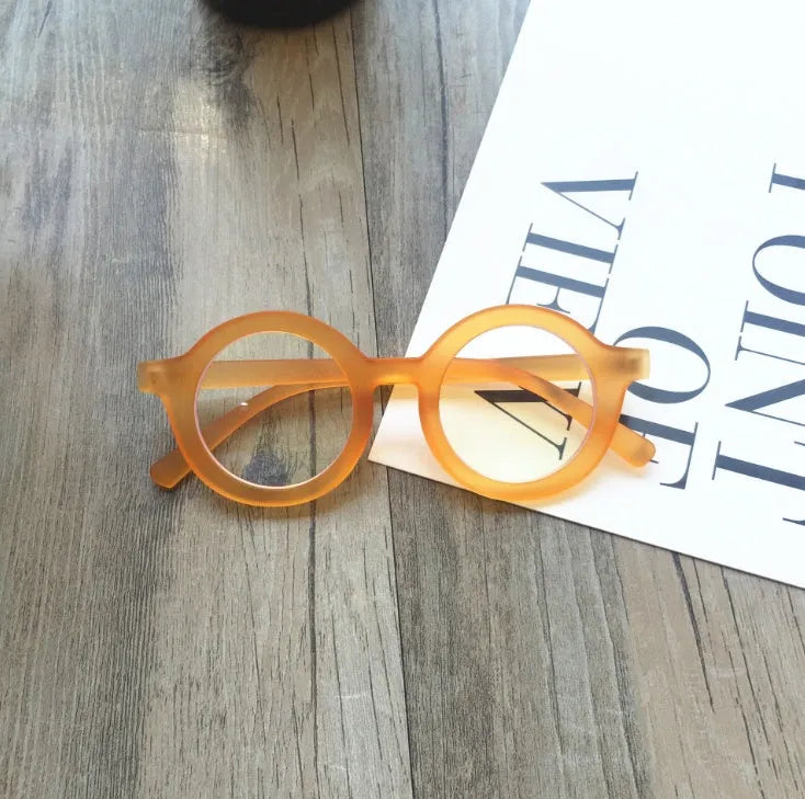 Retro round plastic frame glasses with clear anti-blue light lenses in multiple colour options.
