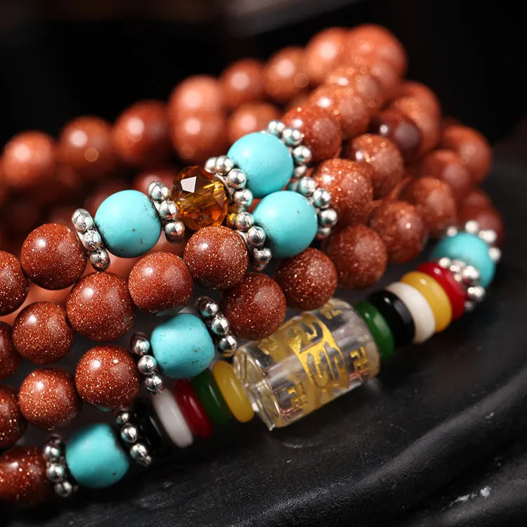 Women's multi-circle bracelet with 108 nugget sand beads, golden star stone accents, and retro fu character charms