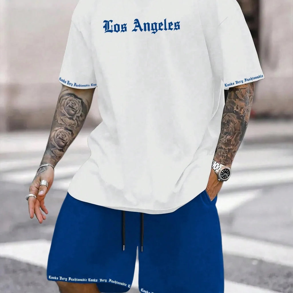 Man wearing a printed short-sleeve top and matching quick-dry sport shorts in a grey colour.