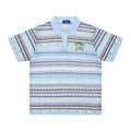 Man wearing a blue loose-fit printed casual shirt with short sleeves.