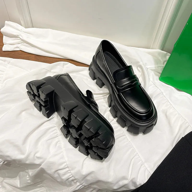 British style wide fit patent leather loafers with a rubber sole and muffin heel, shown in a choice of finishes.