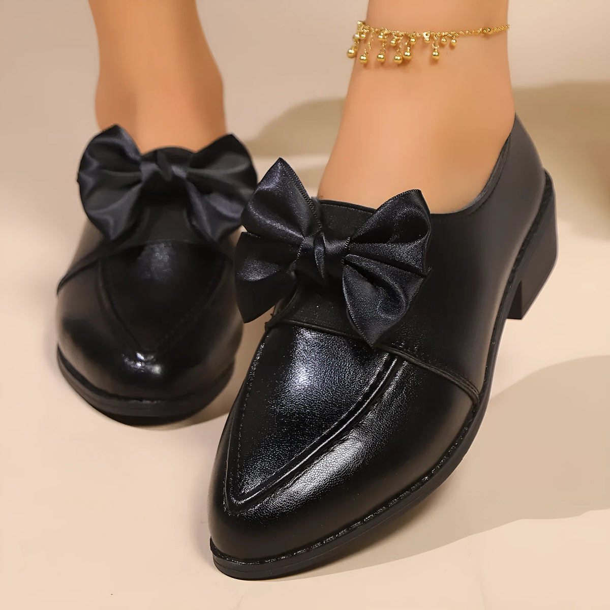 Women's simple leather shoes with bow decoration in British style, showing pointed toe and rubber sole
