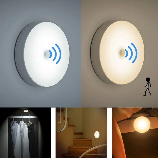 White circular motion sensor night light with USB charging port and adhesive backing