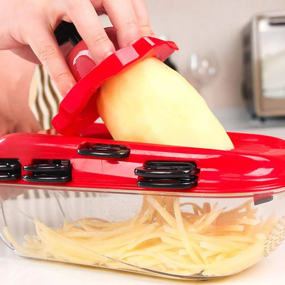 Red multi-function vegetable cutter set with 7 stainless steel blades, clear container, and safety guard