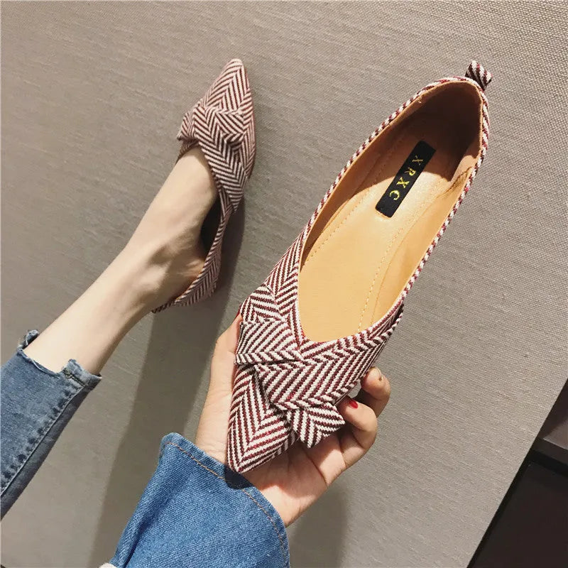 Women's black pointed toe flat shoes with a shallow mouth and cotton upper.