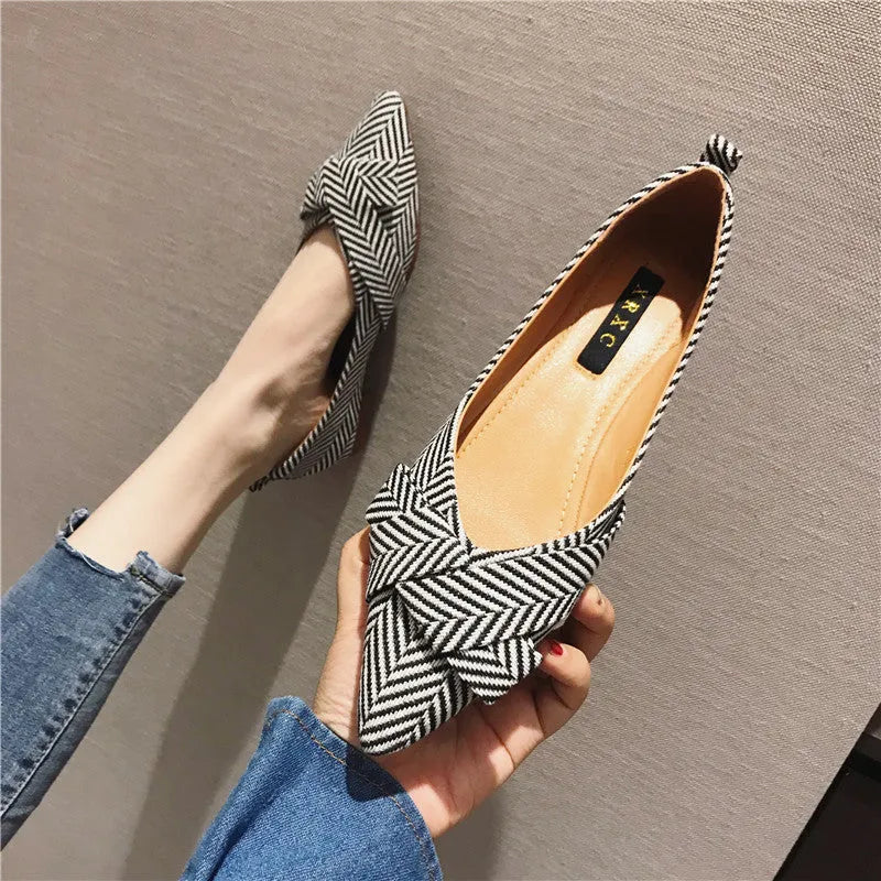 Women's black pointed toe flat shoes with a shallow mouth and cotton upper.