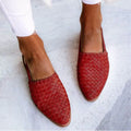 Women's pointed toe buckle flat sandals in microfiber with rubber sole showing buckle closure detail
