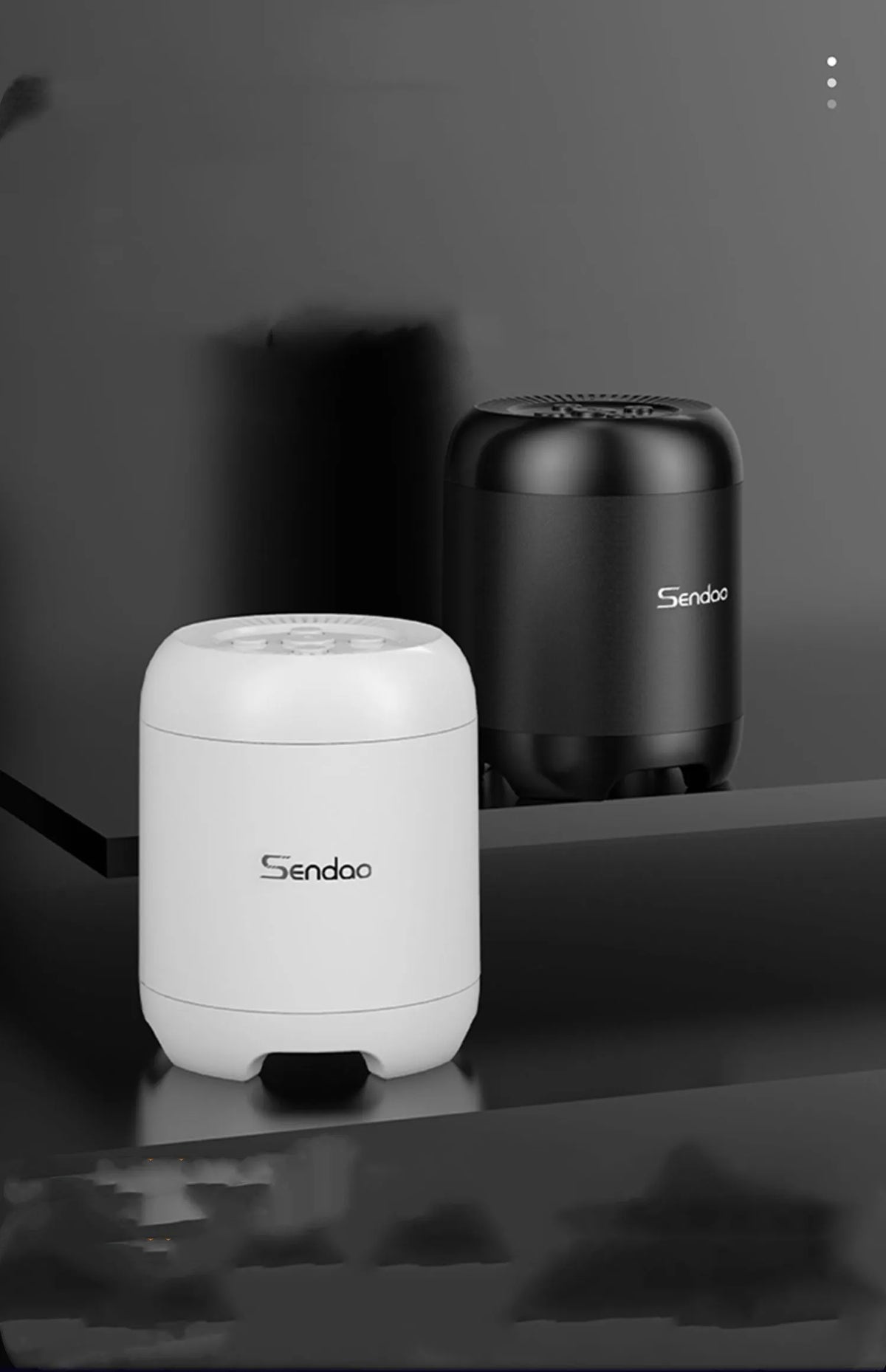 Small black or white portable Bluetooth speaker with card reader slot and USB port.