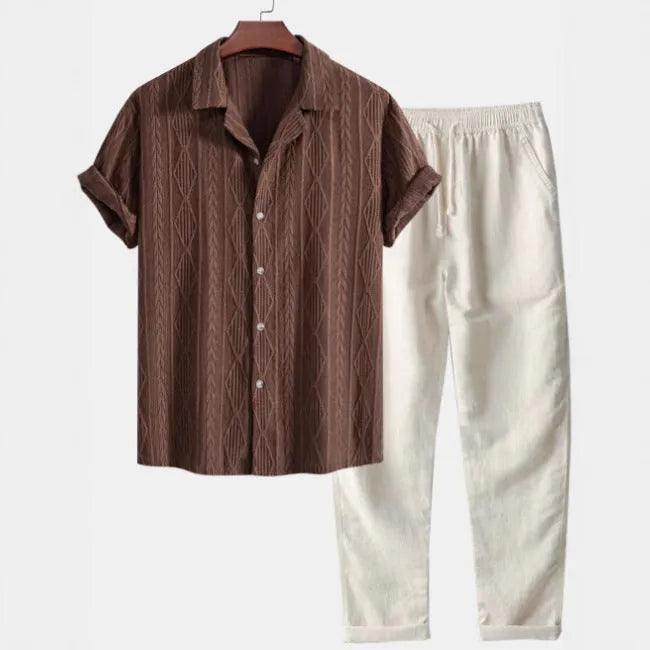 Man wearing a slim-fit linen camouflage print casual suit with short-sleeved shirt and matching trousers.