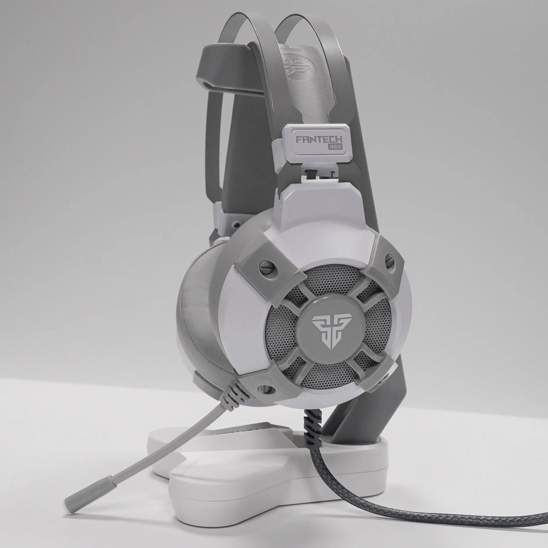Fantech HG11 black gaming headset with RGB lights on ear cups and a USB cable.