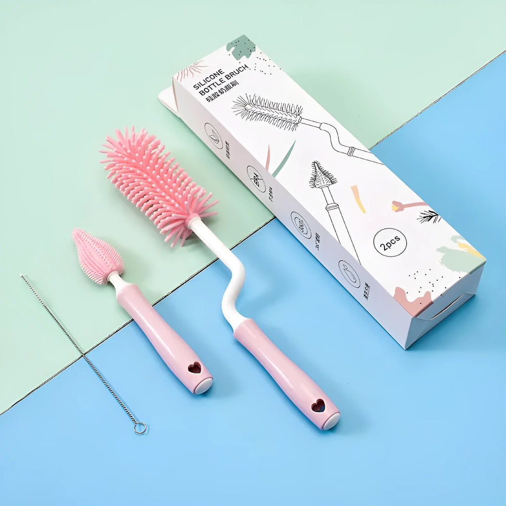 Pink, blue, and yellow silicone baby bottle brush sets with a straw cleaning brush.