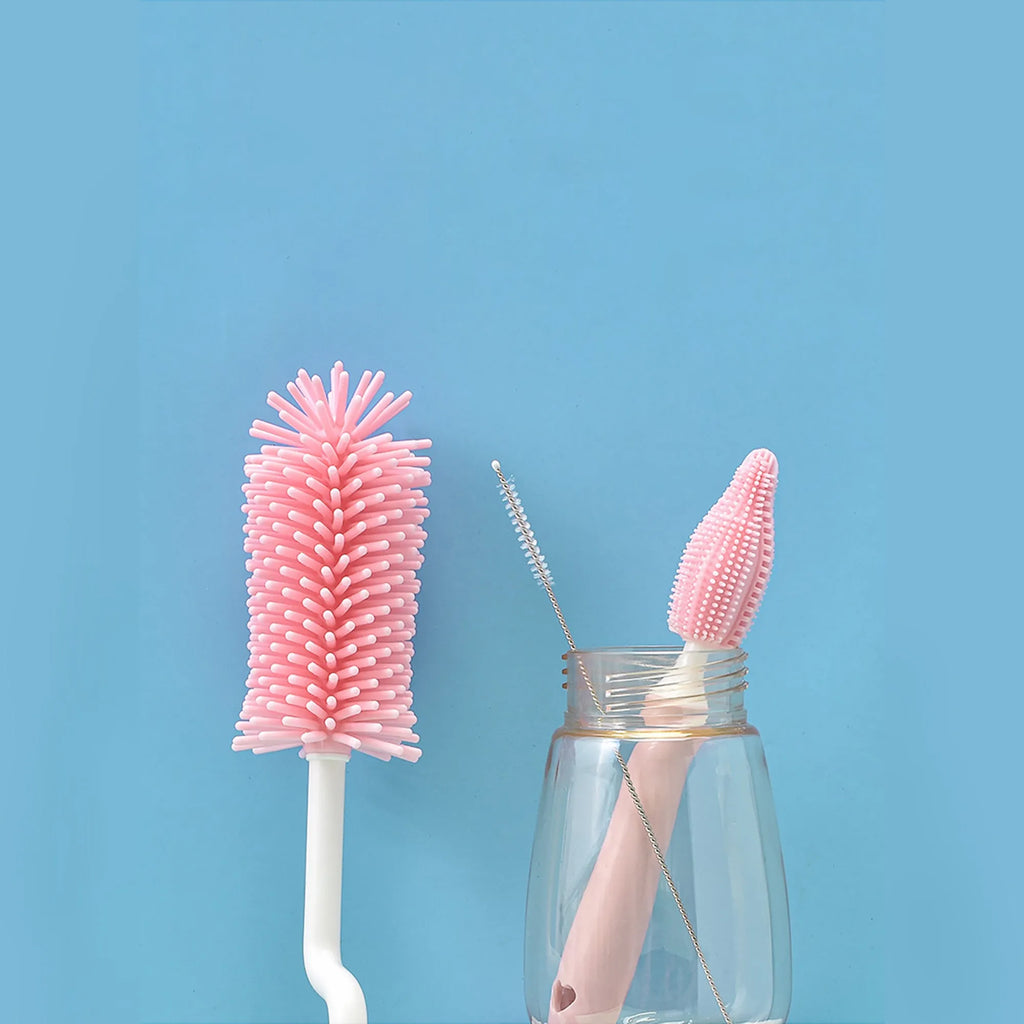 Pink, blue, and yellow silicone baby bottle brush sets with a straw cleaning brush.