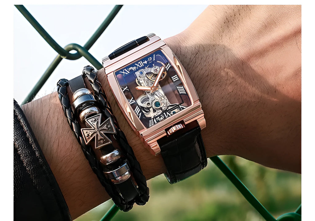 Daystar square stainless steel mechanical watch with leather strap on wrist, showing 42mm dial.