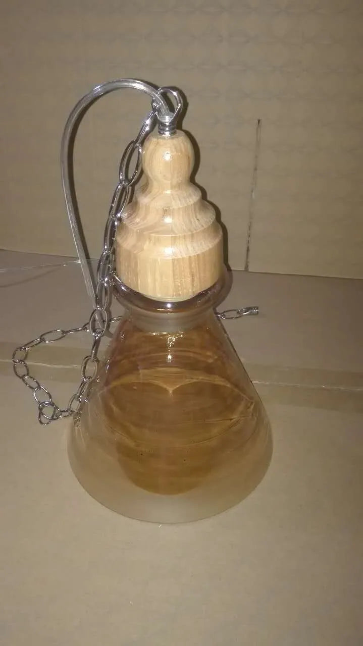 Nordic style glass pendant light with wood grain finish and adjustable hanging cable